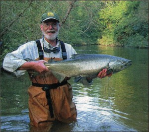 Pete Micol proudly displays a Chinook salmon.