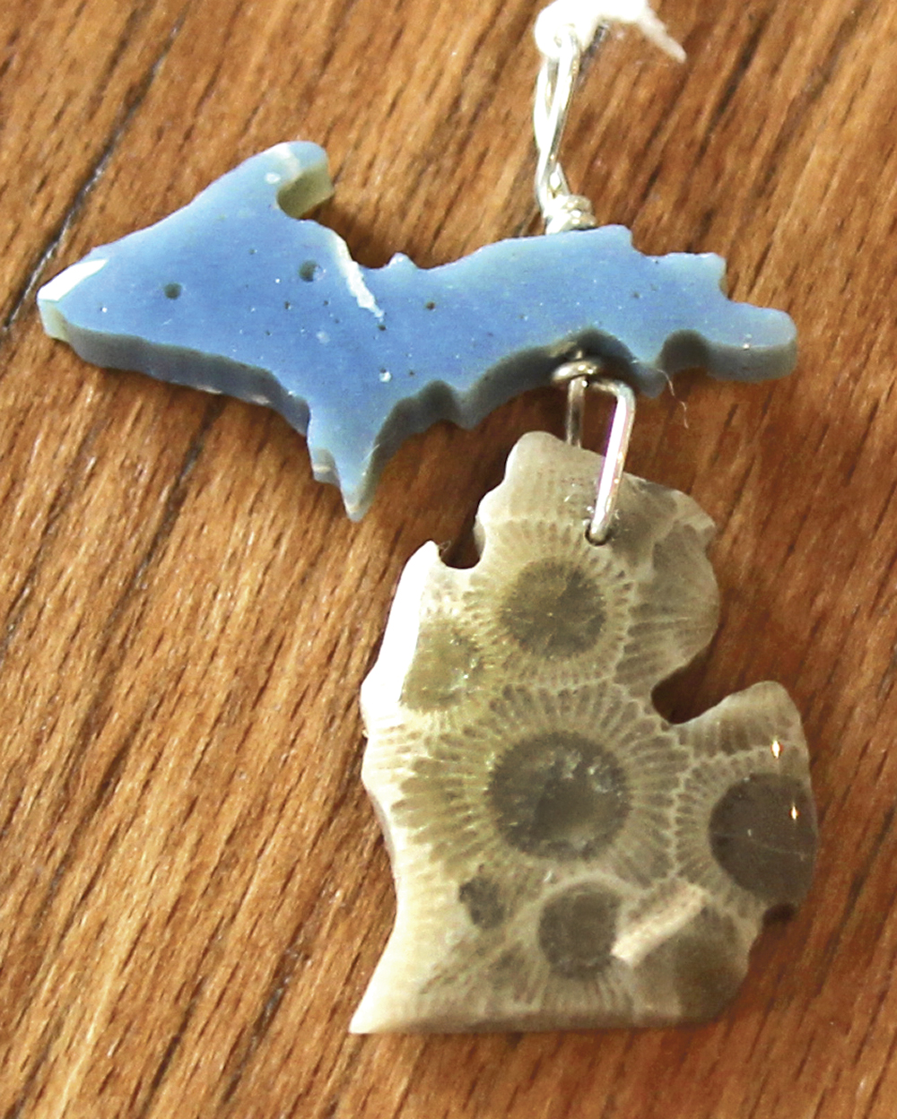 In this necklace, Michigan’s Upper Peninsula is made of Leland blue stone, Leland’s equivalent of slag. The Lower Peninsula is made of Petoskey stone. Photo by Jordan Bates.